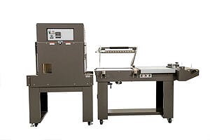 Industrial packaging machine with conveyor belt for automated processing.