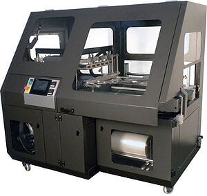 Industrial packaging machine with touch screen and rollers.