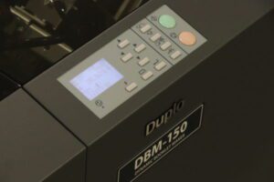 Close-up of a DBM-150 Durox device control panel with buttons and display.