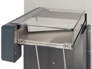 Modern stainless steel appliance with a glass cover and sliding tray.