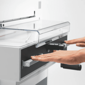 Person using a photocopier with hands placed on the glass.