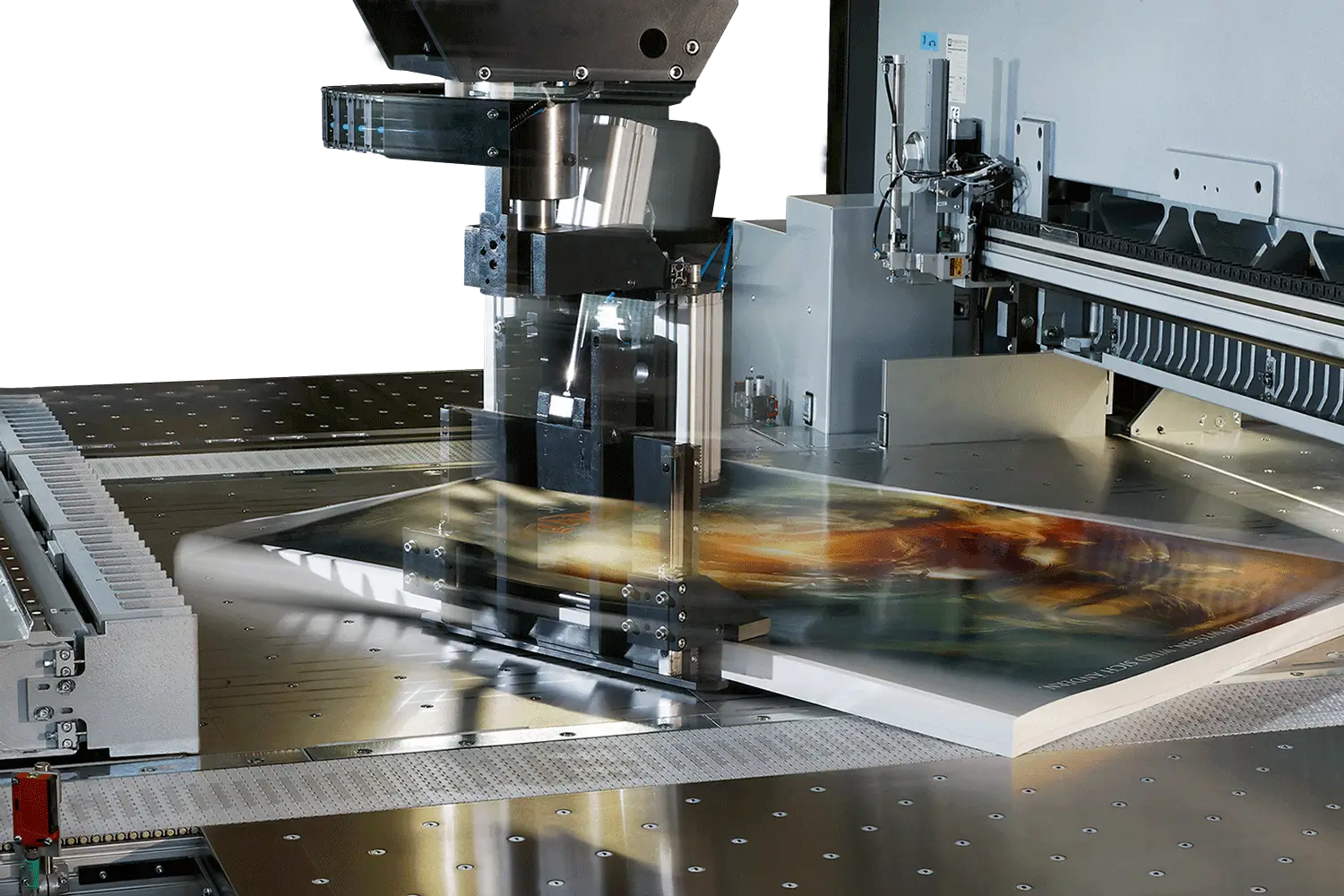 A machine printing colorful images on flat surfaces.