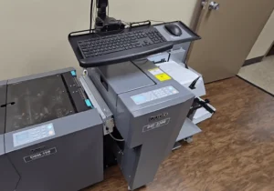 Office printer setup with keyboard and monitor
